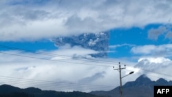 Ashes rise above the Cotopaxi volcano in the Andes mountains about 50km south of Quito, Ecuador, Aug. 14, 2015.