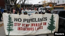 Supporters of the Wet'suwet'en First Nation hereditary chiefs, who are fighting the construction of TC Energy Corp's Coastal GasLink pipeline in British Columbia, march away after a protest on railway tracks in Toronto, Ontario, Canada, Nov. 21, 2021. 