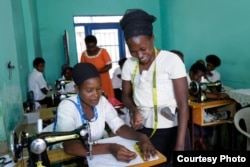 Young women enrolled at the Safi Center, near Kigali, Rwanda, learn income-generating skills such as sewing. (Photo by Christian Gakombe/Safi Center)