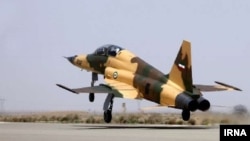 Iran's Kowsar fighter jet, which it says is domestically designed, takes off as part of its unveiling to the world, Aug. 21, 2018.