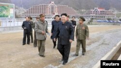 North Korean leader Kim Jong Un (front) visits the construction site of a ski resort on Masik Pass, in this undated photo released by North Korea's Korean Central News Agency (KCNA) in Pyongyang on Nov. 3, 2013.