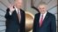 Turkish Prime Minister Binali Yildirim (R) as US Vice President Joe Biden waves as they pose for a photograph before their meeting at Cankaya Palace in Ankara, Aug. 24, 2016.