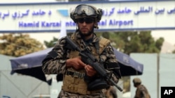 FILE - Taliban special force fighters stand guard outside the Hamid Karzai International Airport after the U.S. military's withdrawal, in Kabul, Afghanistan, Aug. 31, 2021.