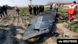 The debris of the Ukraine International Airlines, flight PS752, Boeing 737-800 plane that crashed after take-off from Iran's Imam Khomeini airport, on the outskirts of Tehran, Iran January 8, 2020 is seen in this screen grab.