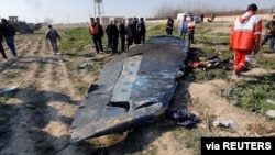General view of the debris of the Ukraine International Airlines, flight PS752, Boeing 737-800 plane that crashed after take-off from Iran's Imam Khomeini airport, on the outskirts of Tehran, Iran January 8, 2020 is seen in this screen grab obtained…