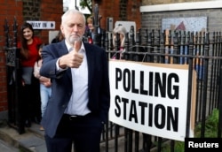 Britain's Labour Party leader Jeremy Corbyn gestures after voting at a local polling station in his constituency in London, May 23, 2019.