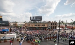 Protesters arrive at Wrigley Field to demand more government action against gun violence, Aug. 2, 2018, in Chicago.