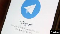 The Telegram logo is seen on a screen of a smartphone in this illustration, April 13, 2018.
