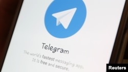 The Telegram logo is seen on a screen of a smartphone in this illustration, April 13, 2018.