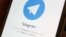 The Telegram logo is seen on a screen of a smartphone in this illustration, April 13, 2018.