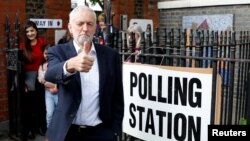 Britain's Labour Party leader Jeremy Corbyn gestures after voting at a local polling station in his constituency in London, May 23, 2019.