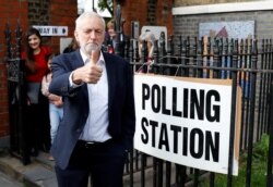 FILE - Britain's Labour Party leader Jeremy Corbyn gestures after voting at a local polling station in his constituency in London, May 23, 2019.