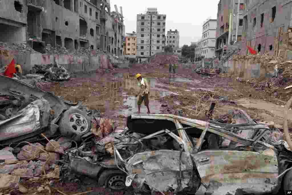 A man walks at the site where a garment factory building collapsed on April 24 in Savar, near Dhaka, Bangladesh, May 13, 2013. 
