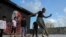 FILE - In this July 2, 2021, photo, a student performs during a group class to learn breaking or 'b-boying' at a training session on the rooftop of a building in Dharavi slums in Mumbai.