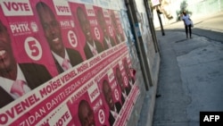 FILE - Election posters of presidential candidate Jovenel Moise of PHTK political Party are seen on a wall in Port-au-Prince, Dec. 22, 2015. 