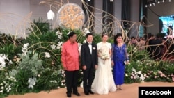 Prime Minister Hun Sen and his wife in picture with Sok Sokan, the son of the late Council of Ministers President Sok An, and Sam Ang Leakhena whose parents own Vattanac Capital on their wedding day in June. (Facebook)