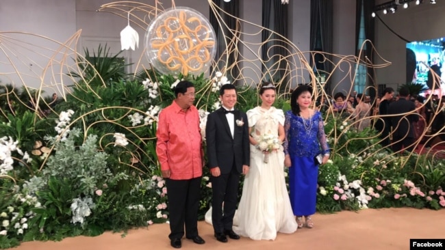 Prime Minister Hun Sen and his wife in picture with Sok Sokan, the son of the late Council of Ministers President Sok An, and Sam Ang Leakhena whose parents own Vattanac Capital on their wedding day in June. (Facebook)