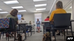 Veronica Johnson, center, director of elections and registration at the Lee County Board of Elections and Registration, conducts a training session for Lee County poll workers in Leesburg, Georgia, Oct. 2, 2024.