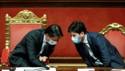 Italian Prime Minister Giuseppe Conte speaks with Health Minister Roberto Speranza during a session of the upper house of parliament, in Rome, July 28, 2020.