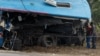 FILE: People inspect the wreckage of one of two buses that collided Nov. 7, 2018, along the Harare-Mutare highway near Rusape, Zimbabwe, Nov. 8, 2018.