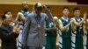 Dennis Rodman tips his hat as U.S. and North Korean basketball players applaud at the end of an exhibition basketball game in Pyongyang, Jan. 8, 2014. 