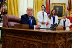 President Donald Trump speaks during an event to sign a proclamation in honor of World Nurses Day, in the Oval Office of the White House, in Washington, May 6, 2020.
