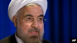 Presiden Iran Hassan Rouhani berbicara dalam acara yang diselenggarakan Masyarakat Asia dan Dewan Hubungan Luar Negeri di New York (26/9/2013). Dibawah kepemimpinan Rouhani, perundingan nuklir Iran membawa harapan baru.