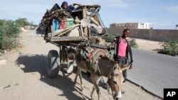 FILE - Somalis are seen leaving the Somali capital Mogadishu, due to hunger, for a refugee camp.