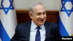 FILE - Israeli Prime Minister Benjamin Netanyahu attends the weekly cabinet meeting in Jerusalem, July 30, 2017. 