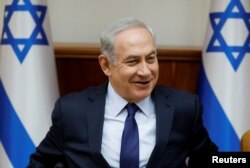 FILE - Israeli Prime Minister Benjamin Netanyahu attends the weekly cabinet meeting in Jerusalem, July 30, 2017.
