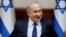 FILE - Israeli Prime Minister Benjamin Netanyahu attends the weekly cabinet meeting in Jerusalem, July 30, 2017. 
