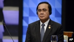 FILE - Thailand's Prime Minister Prayut Chan-o-cha listens to the opening remarks during the plenary session at the Asia-Pacific Economic Cooperation (APEC) Summit in Manila, Philippines, Nov. 19, 2015.