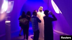 People look at technology exhibits at the Museum of the Future, an innovation exhibition held at the World Government Summit, in Dubai, Feb. 10, 2016. 