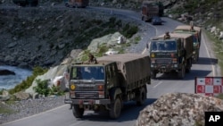 An Indian army convoy moves on the Srinagar- Ladakh highway at Gagangeer, northeast of Srinagar, Indian-controlled Kashmir, Wednesday, Sept. 9, 2020. China and India have been engaged in a tense standoff in the cold-desert Ladakh region since May,…