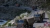 An Indian army convoy moves on the Srinagar- Ladakh highway at Gagangeer, northeast of Srinagar, Indian-controlled Kashmir, Sept. 9, 2020. China and India have been engaged in a tense standoff in the cold-desert Ladakh region. 