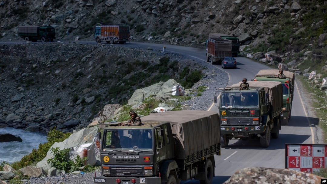 An Indian army convoy moves on the Srinagar- Ladakh highway at Gagangeer, northeast of Srinagar, Indian-controlled Kashmir, Sept. 9, 2020. China and India have been engaged in a tense standoff in the cold-desert Ladakh region. 
