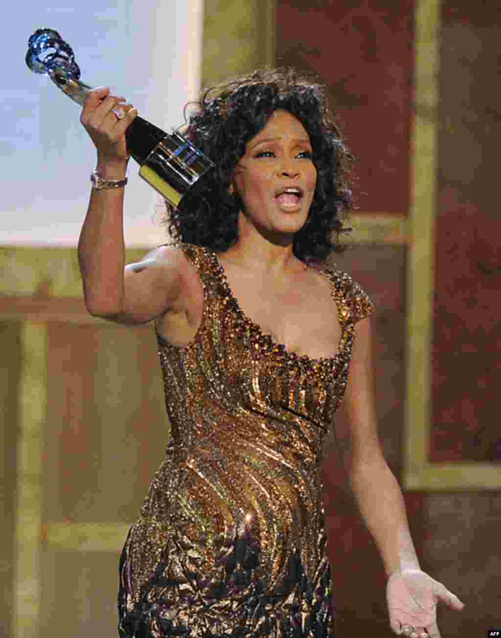 Whitney Houston accepts an award at the Warner Theatre during the 2010 BET Hip Hop Honors in Washington on January 16, 2010. Houston died February 11, 2012, at age 48. (AP)