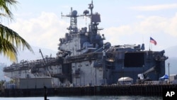 FILE - The amphibious assault ship USS Peleliu is seen docked following joint exercises at the Alava pier, off Subic Bay Freeport zone, northwestern Philippines, Oct. 13, 2014, as part of the Visiting Forces Agreement.