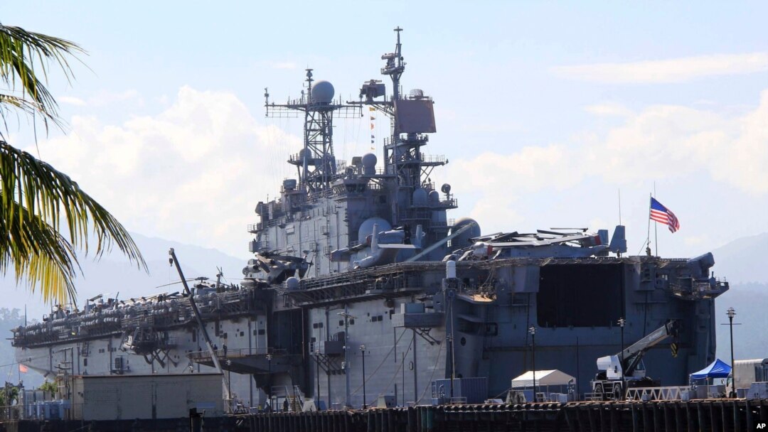FILE - The amphibious assault ship USS Peleliu is seen docked following joint exercises at the Alava pier, off Subic Bay Freeport zone, northwestern Philippines, Oct. 13, 2014, as part of the Visiting Forces Agreement.