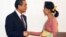 Leader of the National League for Democracy party (NLD) and Myanmar's new foreign minister, Aung San Suu Kyi, shakes hands with Chinese Foreign Minister Wang Yi, in Naypyitaw, Myanmar, April 5, 2016. 