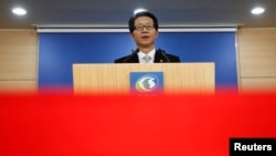 FILE - South Korea's Unification Minister Ryoo Kihl-jae releases a government statement during a news conference at the Unification Ministry in Seoul.