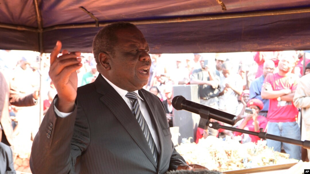 MDC President Morgan Tsvangirai addresses mourners at the burial of activist Rebecca Mafukeni in Harare, Aug. 14, 2013. 