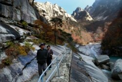 FILE - Local tourists walk on the trail at Mount Kumgang, known as Diamond Mountain, in North Korea, Oct. 23, 2018.