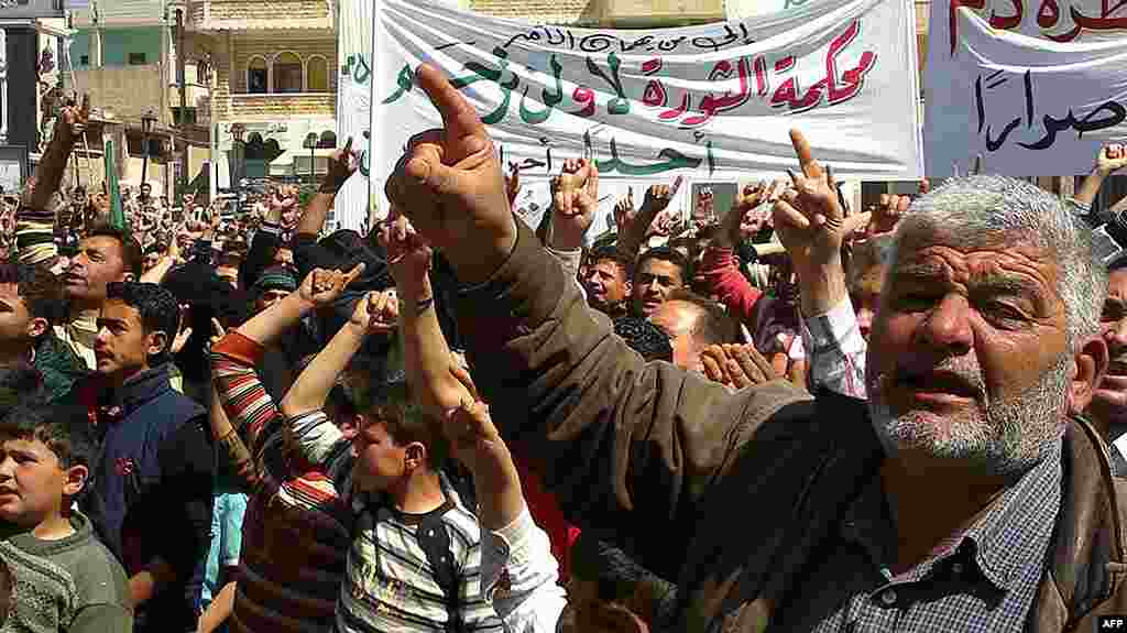 This citizen journalism image shows anti-regime protesters in Binish, Idlib, March 26, 2012. (AP/Edlib News Network)
