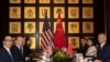 FILE - Chinese Vice Premier Liu He, right, sits with U.S. Trade Representative Robert Lighthizer, second from left, and Treasury Secretary Steven Mnuchin, left, before the start of talks at the Xijiao Conference Center in Shanghai, July 31, 2019.