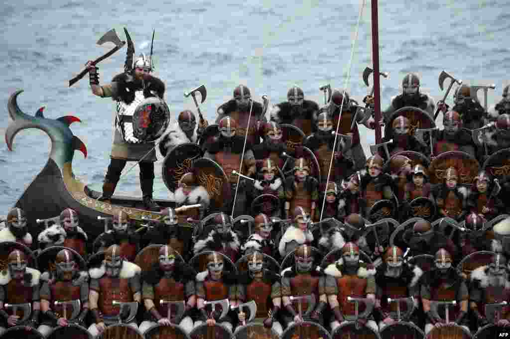 Participants dressed as Vikings in the annual Up Helly Aa festival in Lerwick, Shetland Islands.