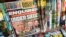 FILE - The cover of an issue of the National Enquirer is shown, featuring President Donald Trump at a store in New York, July 12, 2017. 