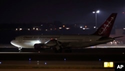 A plane with three American citizens, Mark Swidan, Kai Li and John Leung, who were imprisoned for years by China, arrives at Joint Base San Antonio Lackland, in San Antonio, Texas, Nov. 27, 2024. 