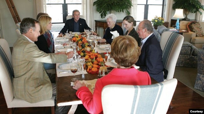 On Nov. 24 2004, President George W. Bush and First Lady Laura Bush host Spain's King Carlos at a Thanksgiving-style luncheon at their ranch near Crawford, Texas, where the meal includes free-range turkey, Prairie Chapel bass, mashed sweet potatoes with m
