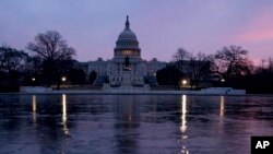 FILE - The U.S. Capitol building is seen at sunrise in Washington, Feb. 9, 2018. 